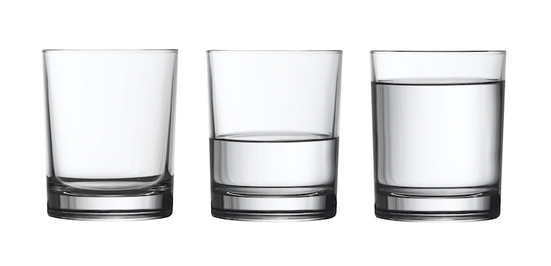 low empty, half and full of water glass isolated on white with clipping path included