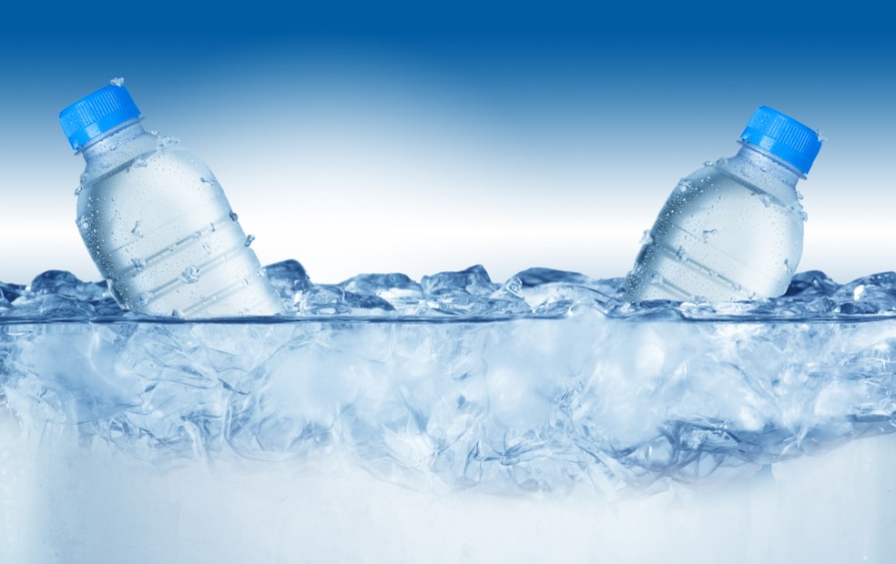 chilled water bottles in ice water